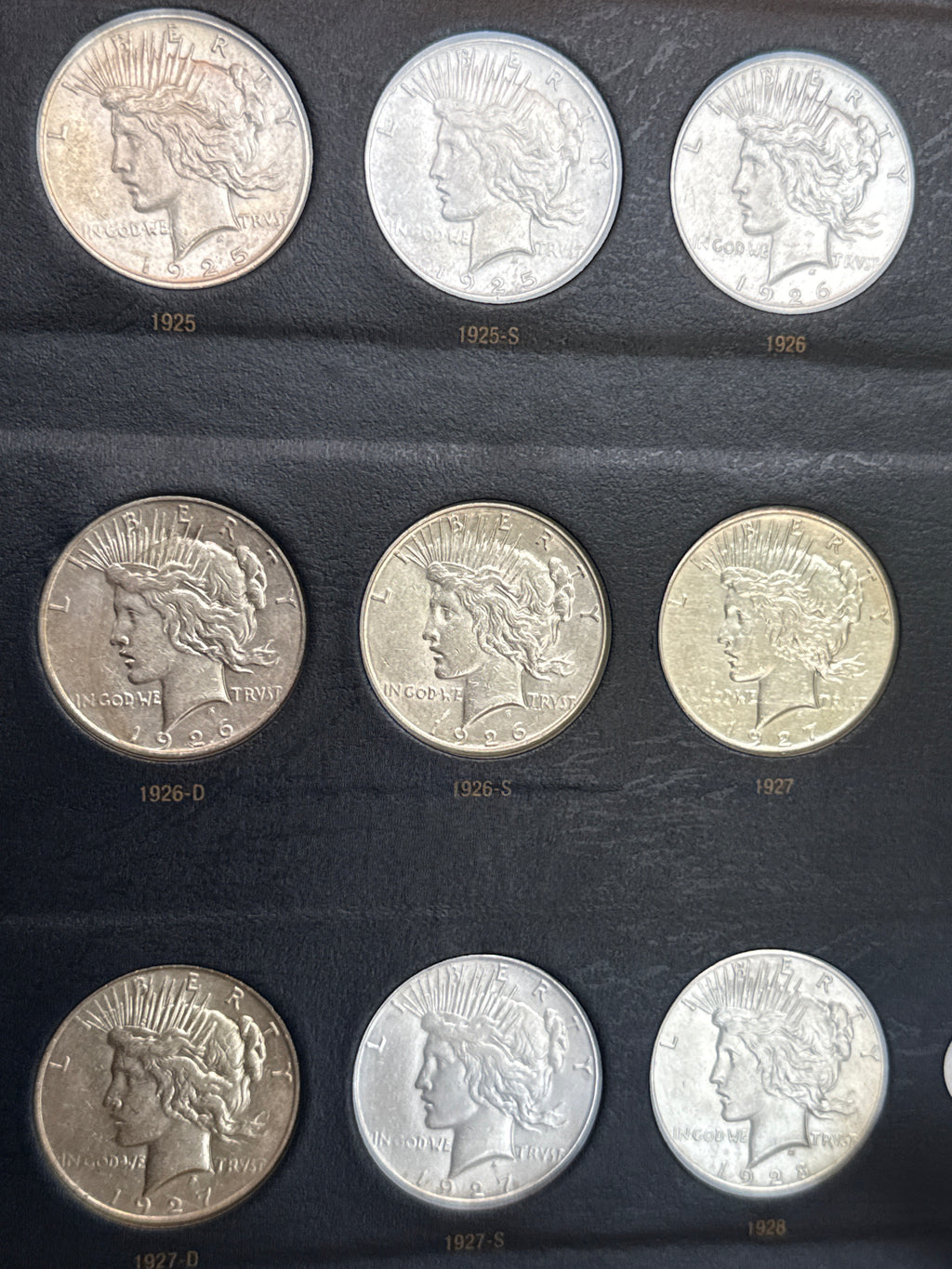 1921-1935-P,D&S American Silver Peace Dollar 24-Coin Set in Whitman Album  Mostly Uncirculated.