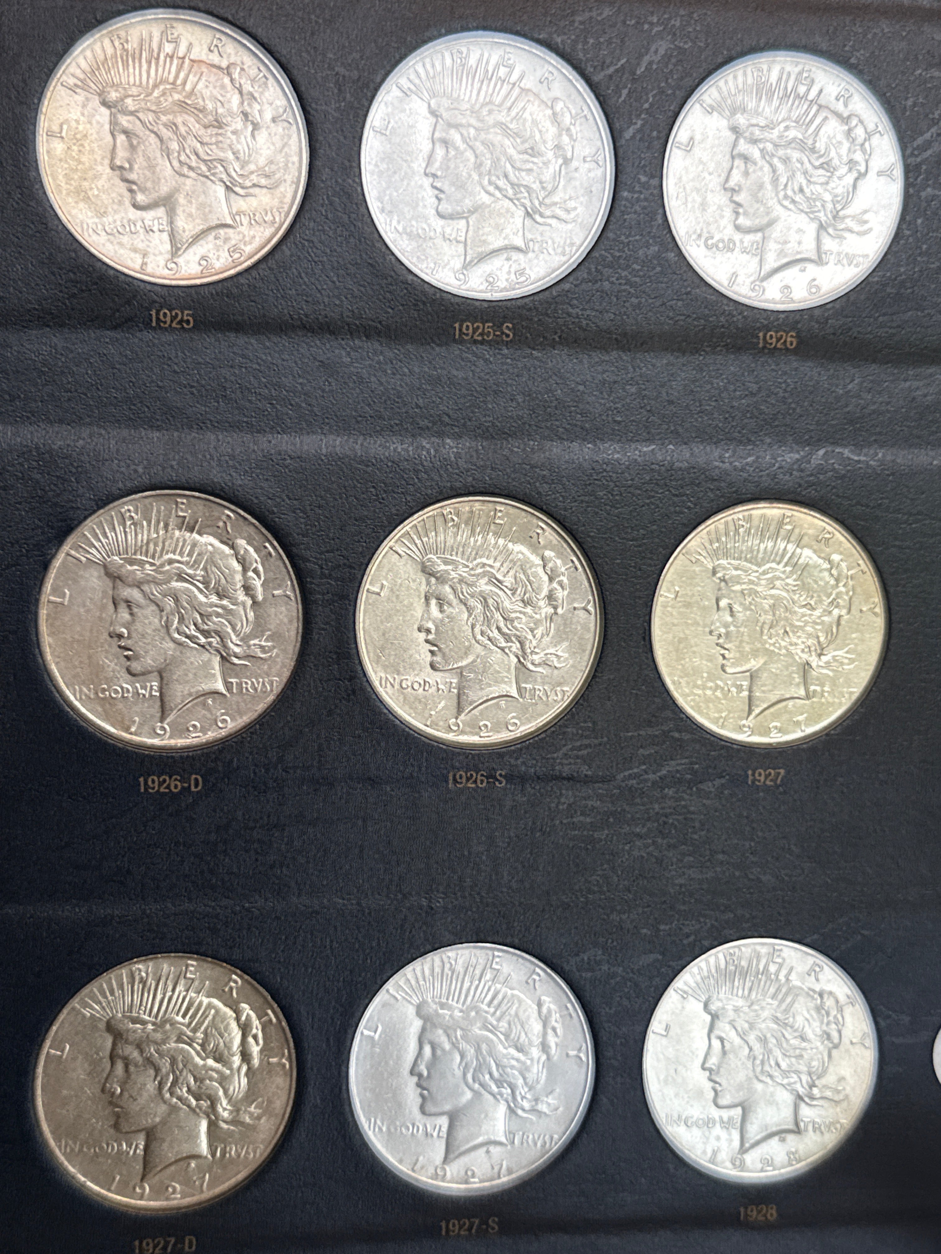 1921-1935-P,D&S American Silver Peace Dollar 24-Coin Set in Whitman Album  Mostly Uncirculated.