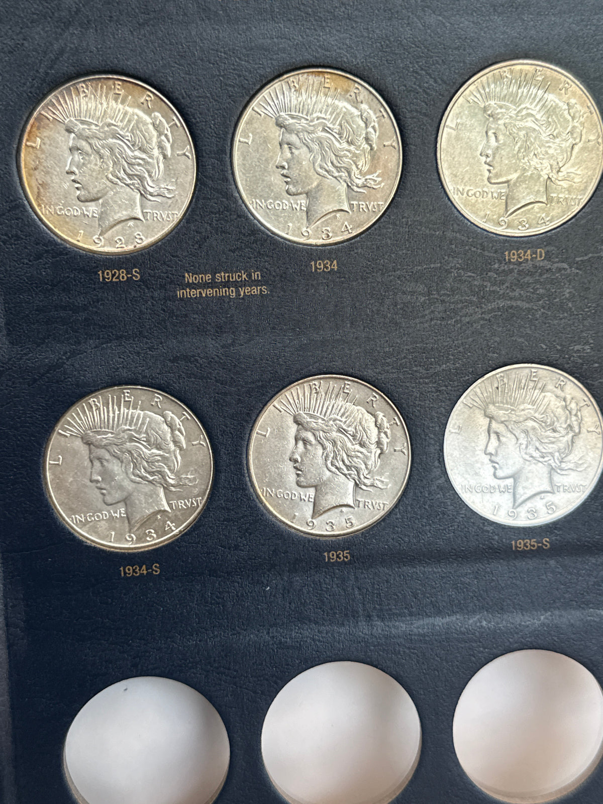 1921-1935-P,D&S American Silver Peace Dollar 24-Coin Set in Whitman Album  Mostly Uncirculated.