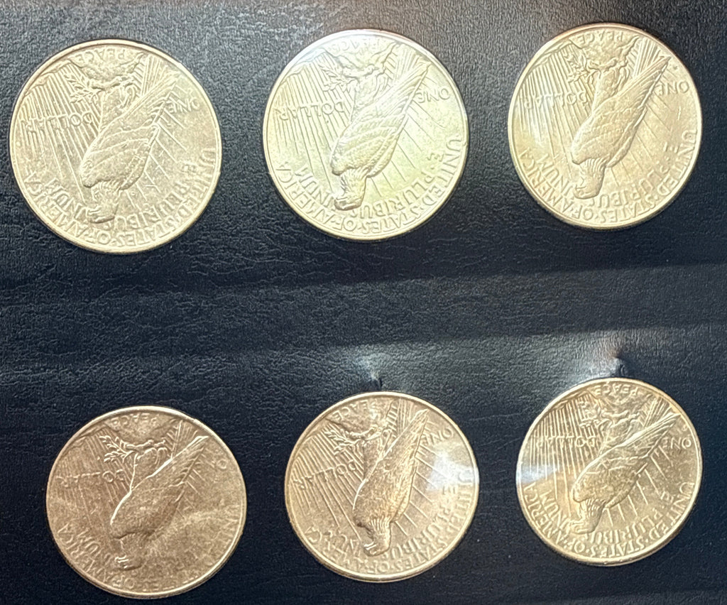 1921-1935-P,D&S American Silver Peace Dollar 24-Coin Set in Whitman Album  Mostly Uncirculated.