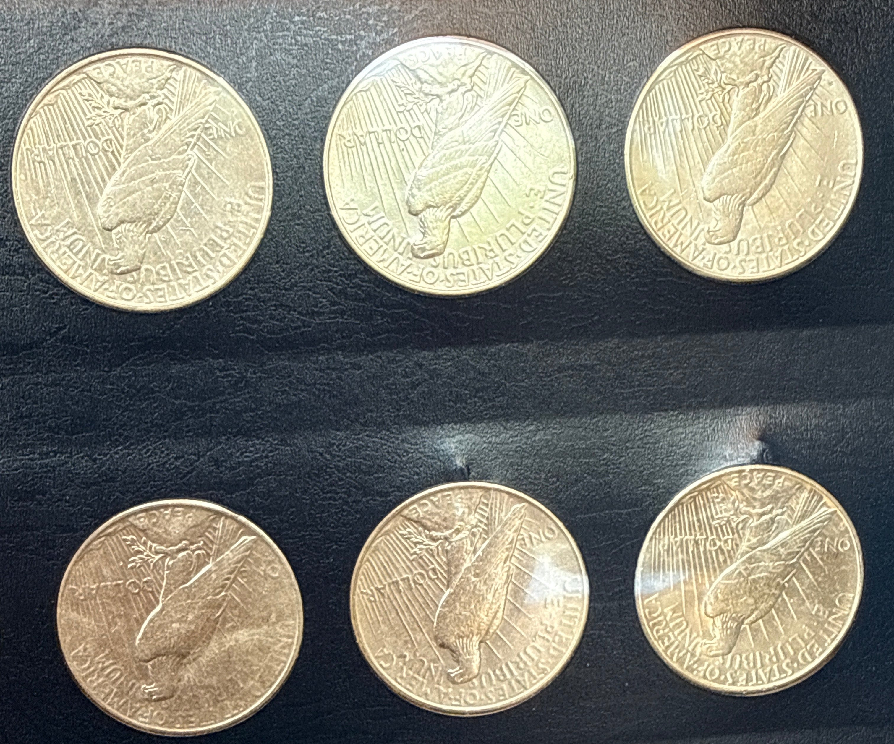 1921-1935-P,D&S American Silver Peace Dollar 24-Coin Set in Whitman Album  Mostly Uncirculated.