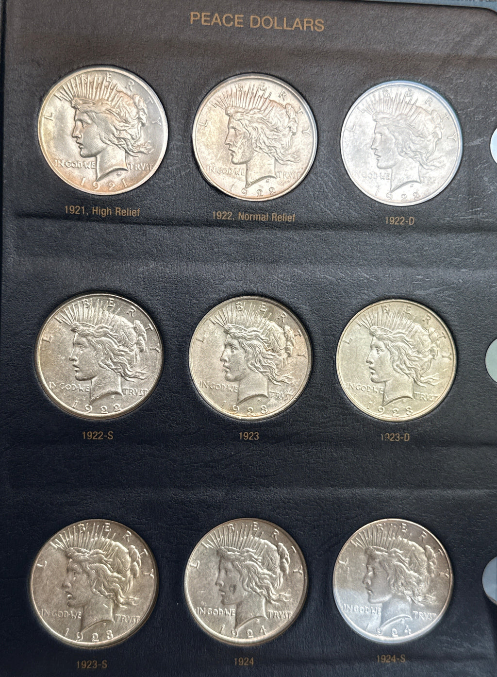 1921-1935-P,D&S American Silver Peace Dollar 24-Coin Set in Whitman Album  Mostly Uncirculated.