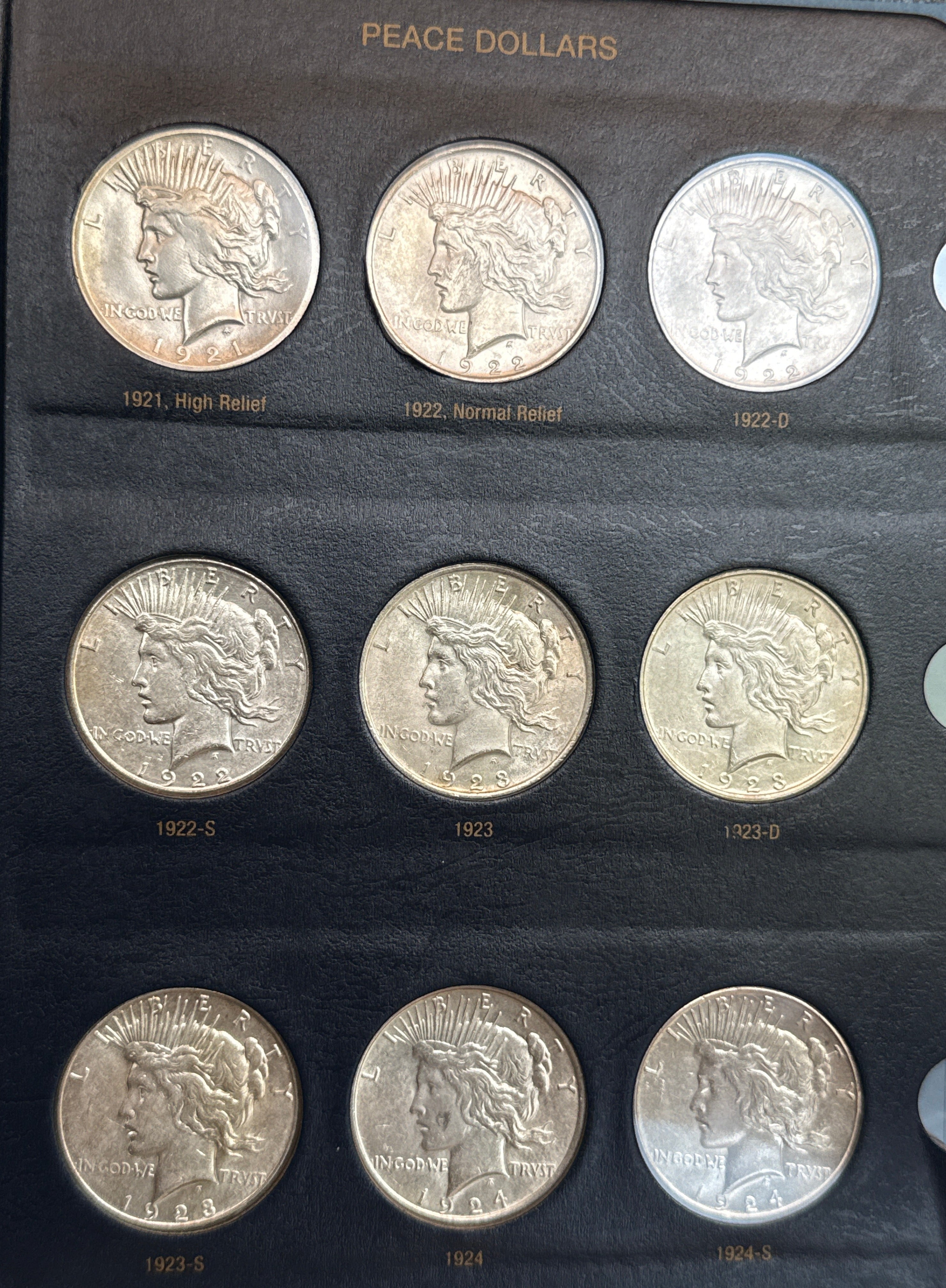 1921-1935-P,D&S American Silver Peace Dollar 24-Coin Set in Whitman Album  Mostly Uncirculated.