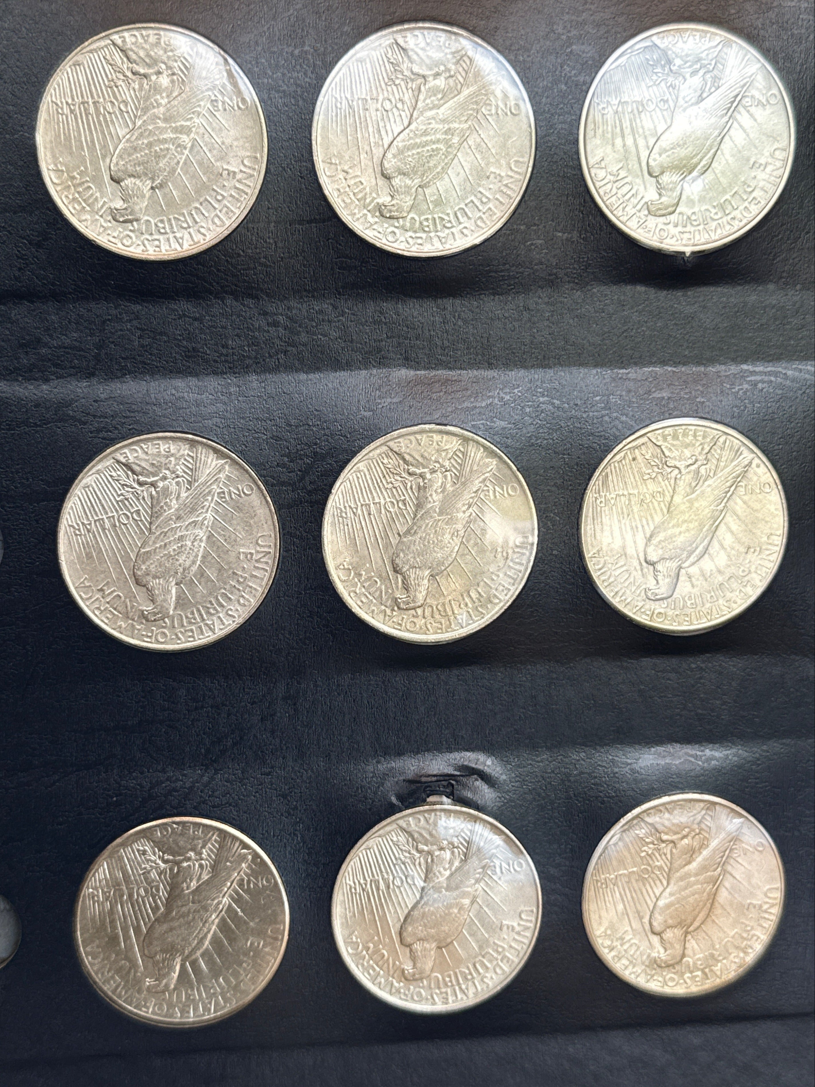 1921-1935-P,D&S American Silver Peace Dollar 24-Coin Set in Whitman Album  Mostly Uncirculated.