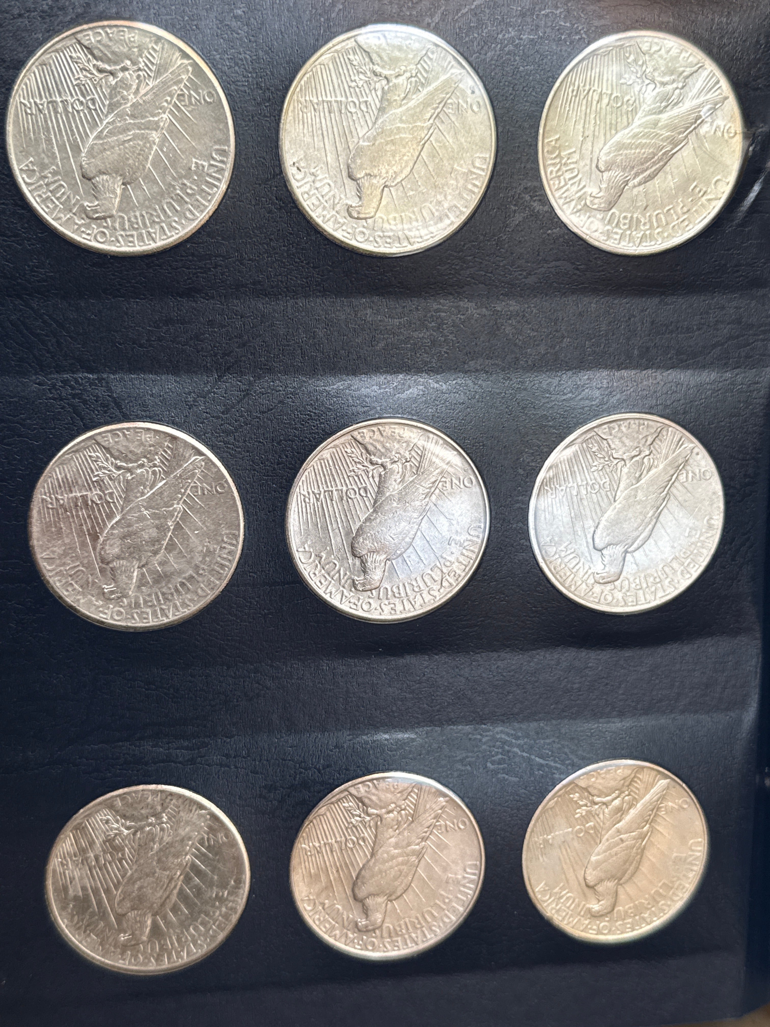 1921-1935-P,D&S American Silver Peace Dollar 24-Coin Set in Whitman Album  Mostly Uncirculated.