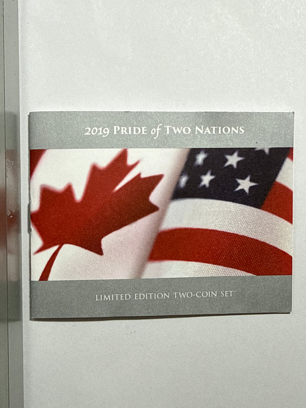 2019 Pride of Two Nations Set Canada $5 Maple Leaf -Canada 2 Coin Box Set with CoA NGC FDI Modified PF70 Susan Taylor. 2019-W Pride of Two Nations American Silver Eagle $1  Canada Set FDI Enhanced Rev PF70 John Mercanti.