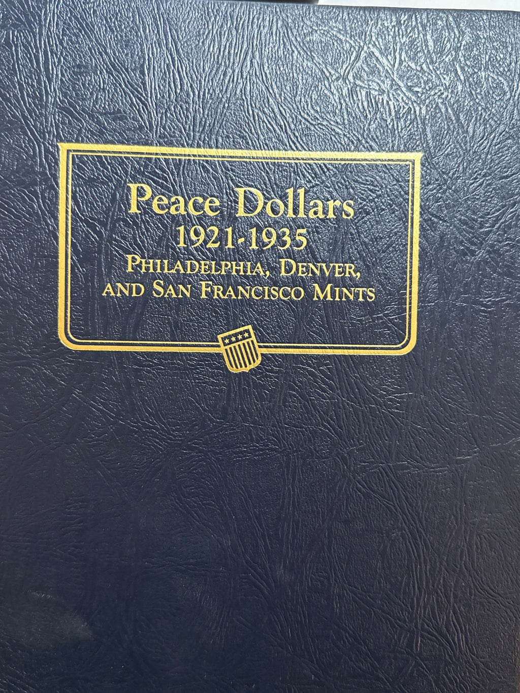 1921-1935-P,D&S American Silver Peace Dollar 24-Coin Set in Whitman Album  Mostly Uncirculated.