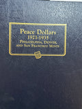 1921-1935-P,D&S American Silver Peace Dollar 24-Coin Set in Whitman Album  Mostly Uncirculated.